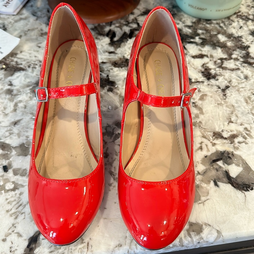 Red patent leather Mary Jane pumps